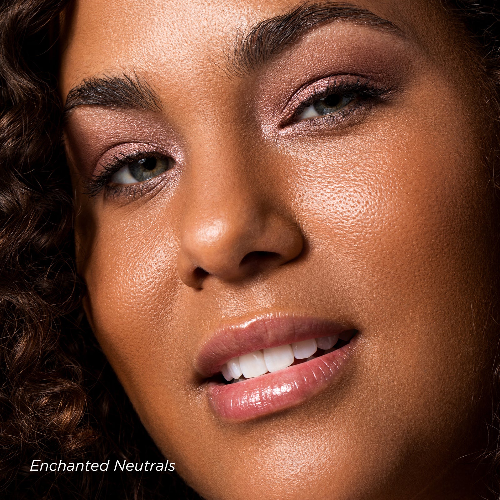 Close-up of a woman's face with makeup, featuring 'Enchanted Neutrals' text.