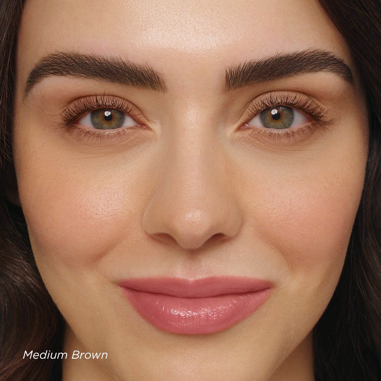 Close-up of a woman's face with medium brown eye color