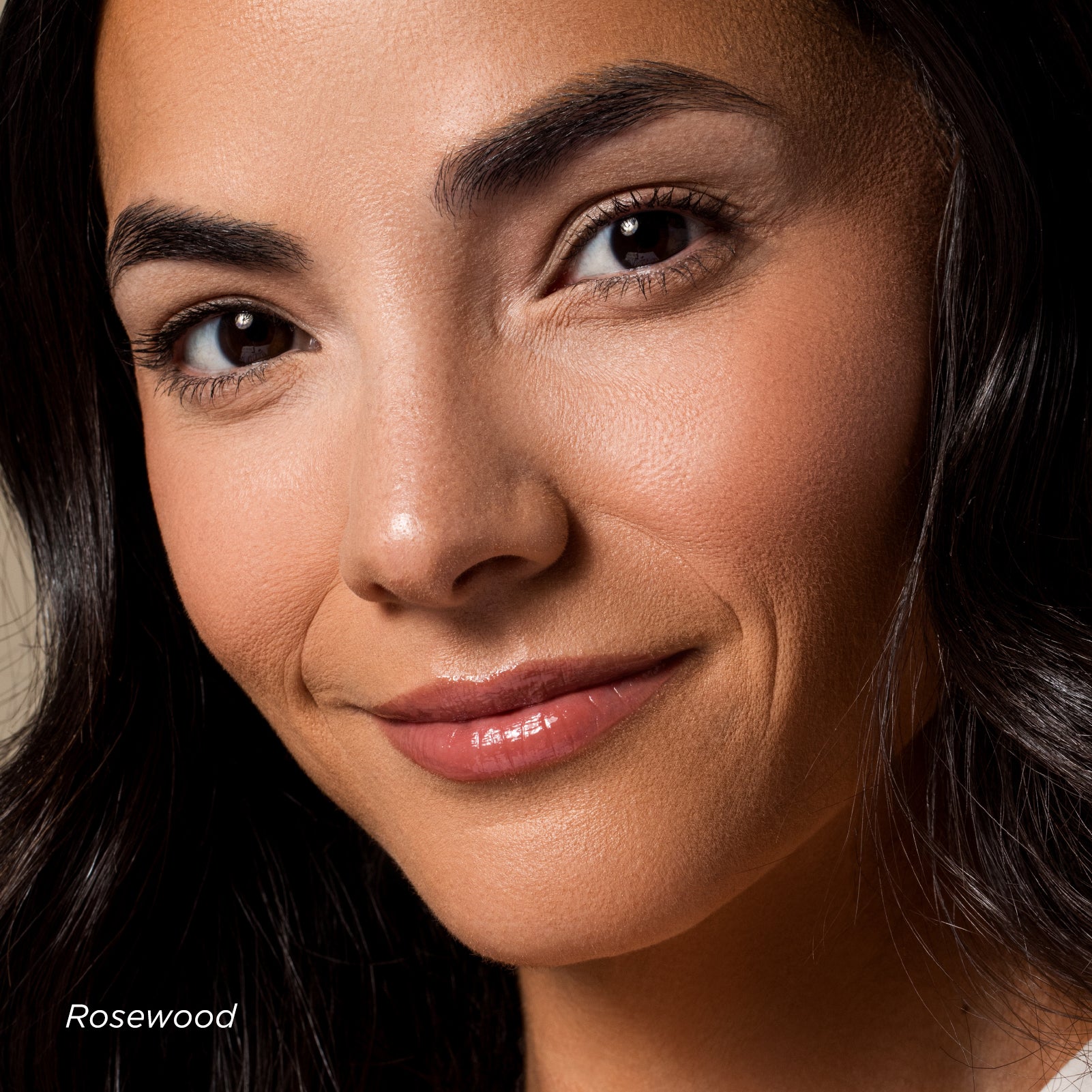 Close-up of a woman's face with a neutral background